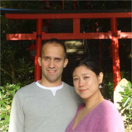 Riho and Gabriel next to torii in Japan